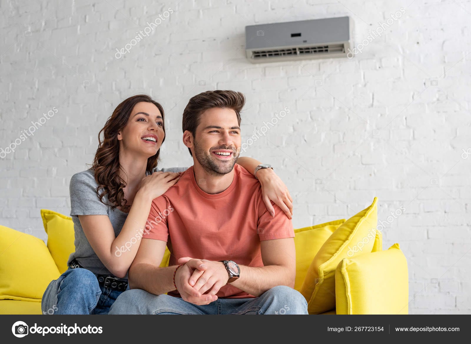 Depositphotos 267723154 Stock Photo Happy Couple Sitting Yellow Sofa