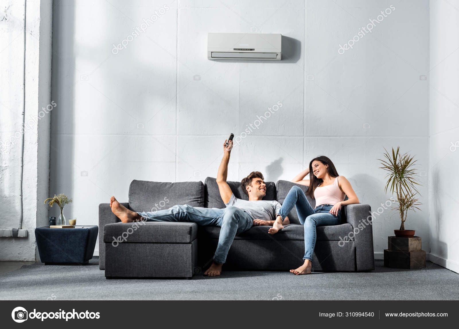 Depositphotos 310994540 Stock Photo Handsome Boyfriend Switching Air Conditioner